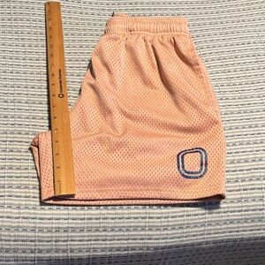 Overtime mesh shorts. Peach, light pink with iridescent logo. OT